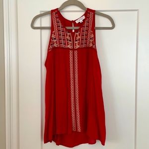 Sleeveless float top with embroidered detail
